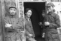 Portrait of Zhon Enlai, Mao Zedong, and Bo Gu standing in doorway