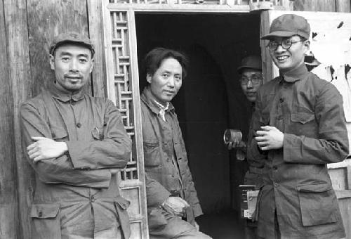 Portrait of Zhon Enlai, Mao Zedong, and Bo Gu standing in doorway