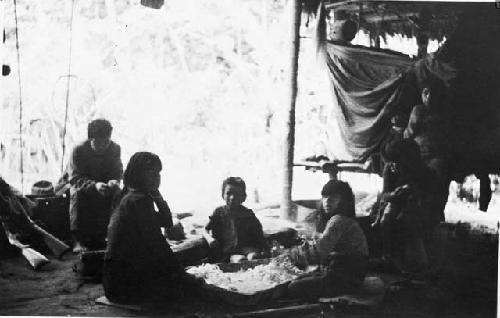 Women showing process of making massato