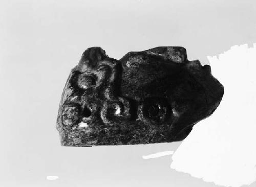 Fragment of carved Jadeite in shape of human head, profile view
