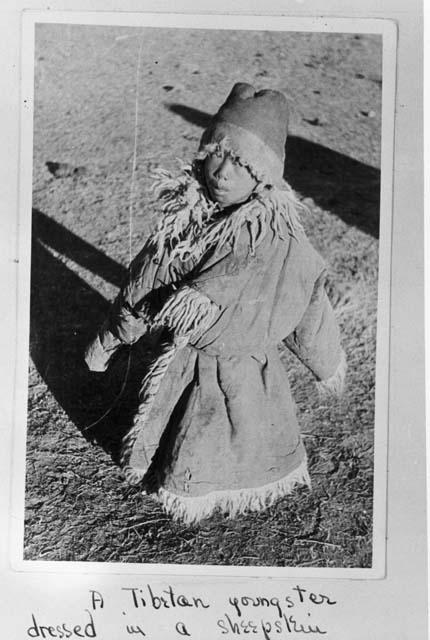 Tibetan youngster dressed in sheepskin