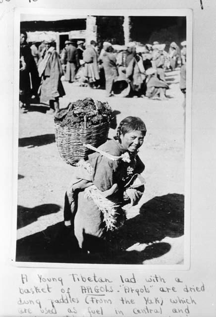 Young boy with basket of argols