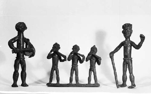 Five brass male figurines