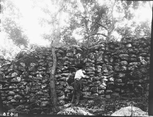 Man standing beside Great Wall