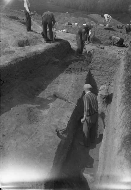 House complex 100 - looking west, trenching in