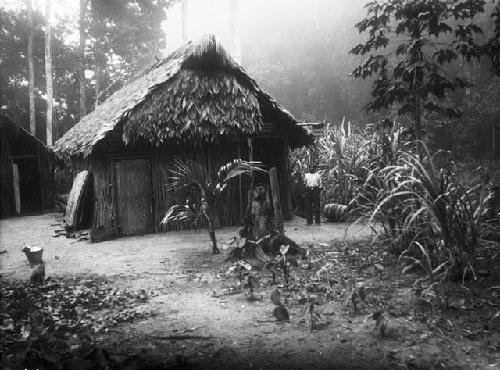 Man standing near trading post at Kokerite