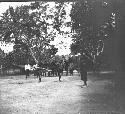 Men standing in village street