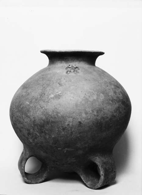 Large round pottery jar with tripod looped leg base