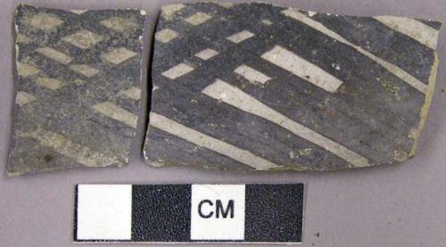 Sherd with black on white exterior geometric designs