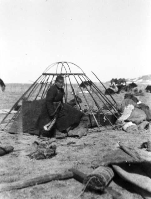 Torgut women setting up yurt trellises