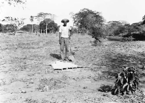 Federico Guerida, Jr. standing with shovel