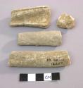 4 miscellaneous pieces of stone (petrified bone ?)