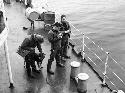 Members of expedition en route, on ship deck