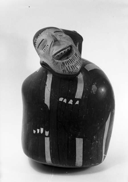 Human effigy pottery vessel