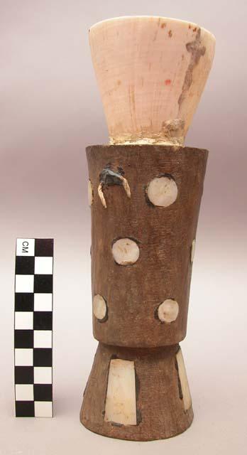 Wooden cup with shell inlay and cone-shaped shell top