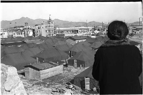 Person looking down on a large group of tents