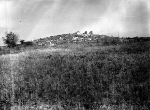 Church ruins and modern graves on top. Tumba site, facing west