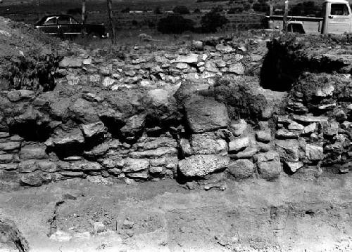 View of excavation site, and shots of artifacts