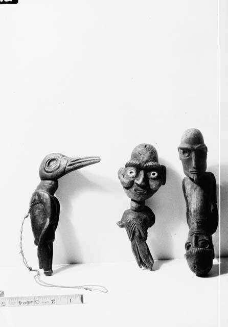 Wooden human and bird figures