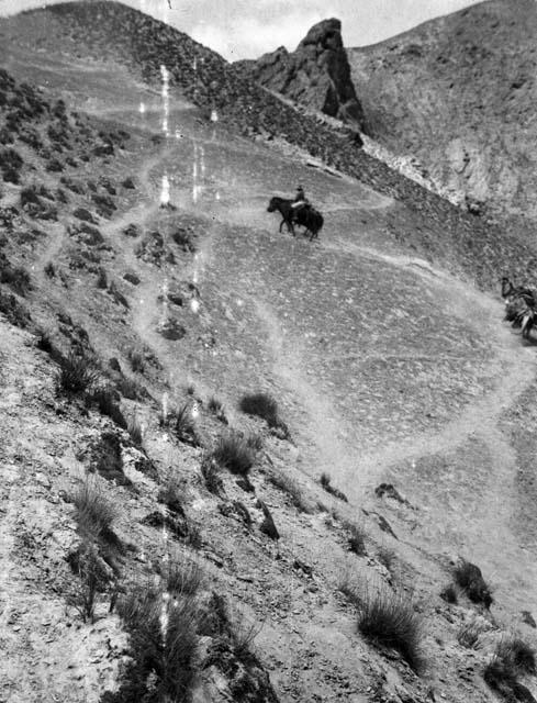 Chuchu Davan (Dawan), Eleanor Lattimore on horse ascending mountain