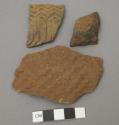 Three pottery sherds, each has imprinted design on one side