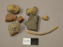 Ceramic, earthenware body sherds, red-bodied, grit-tempered, two sherds crossmend; stones and stone fragments, likely non-cultural; twine fragment