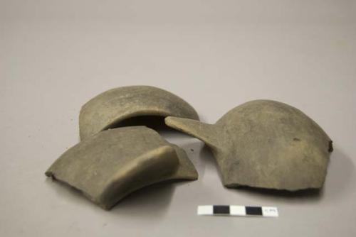 Ceramic sherds of a bowl, polished exterior, 2 protruding flat handles