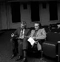 Karl Lamberg-Karlovsky and Irv Devore sitting in auditorium
