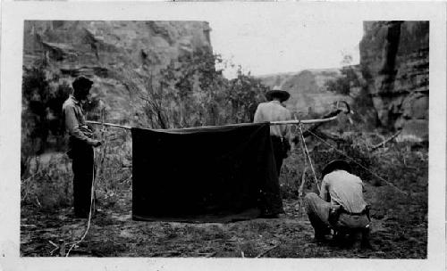 Bill pitching tent with much help