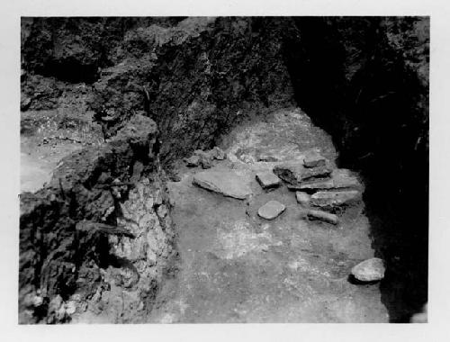 Pit House B; manos, metates, and slabs on floor of southend, east side.