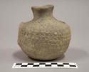 Small imitation corrugated pottery handled jar