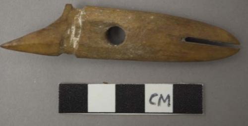 Utilized bone, shaft of a bone hook, perforated and notched, four grooves