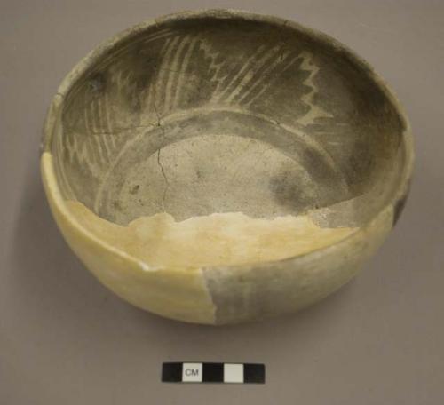 Black on white pottery bowl--restored