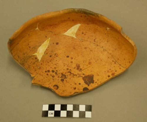 Fragments of stippled pottery bowl