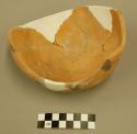 Part of San Bernardino black-on-yellow pottery bowl