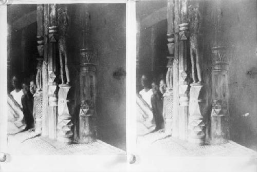 Carved posts at the entrance to a Loma Palaver house