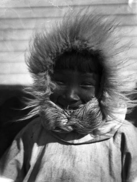 Boy wearing fur hood