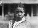 Young, mixed race girl with braid