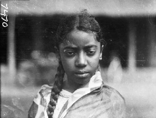 Young, mixed race girl with braid