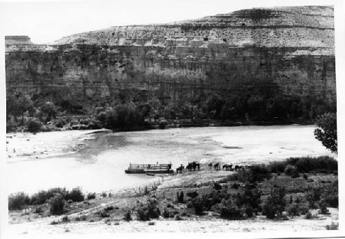 Expedition boarding the current ferry on the Green River in route from hill