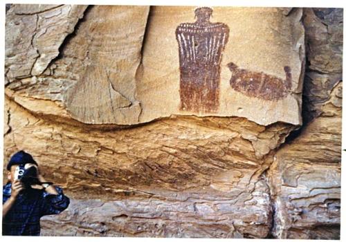 Petroglyph and photographer. Displays what we called "Cleopatra" in 1928