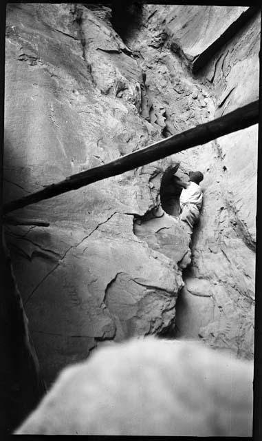 Person climbing rocks