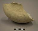 Medium sized undecorated pottery jar fragment