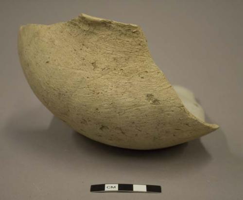 Medium sized undecorated pottery jar fragment