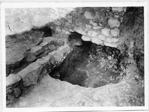 Kiva; Southwest cist; showing radiating walls built on fill in cist