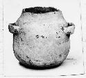 Small, undecorated, strap-handled jar