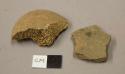 Animal bone fragment; earthenware body sherd, shell tempered