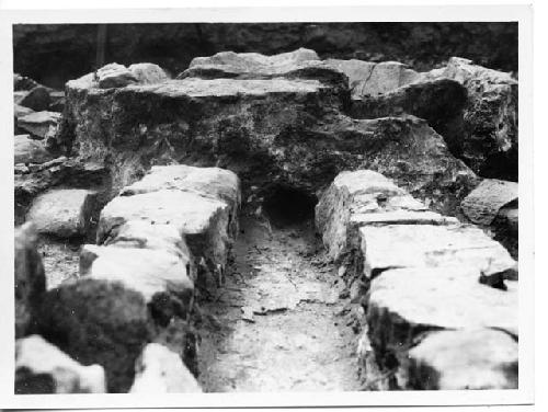 Photo of Kiva; "channel," showing tunnel into firepit