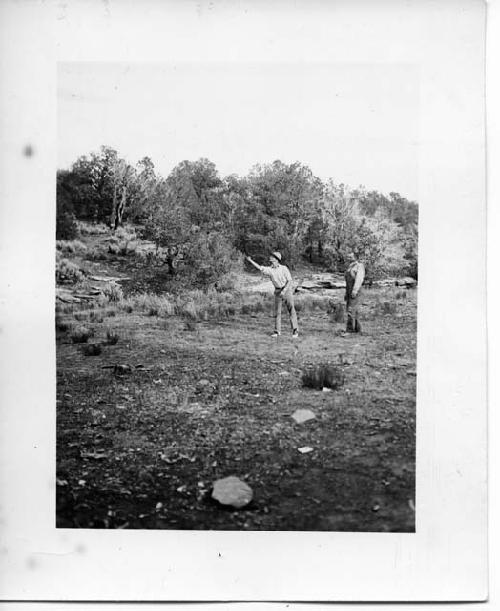 Photo of Jimmy Dennison Pitching- horseshoes. Al Lancaster awating his turn