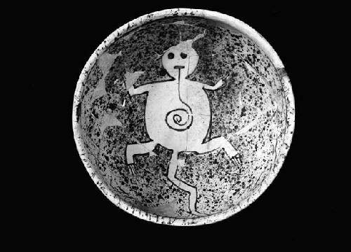 Restored pottery bowl with Zoomorphic figure